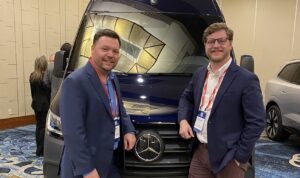Two men at the 2025 Automotive Summit.