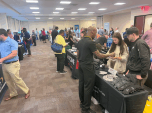 Attendees and staff members participating in a career fair.
