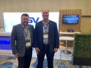 Two smiling attendees of the 2024 SC Automotive Summit.